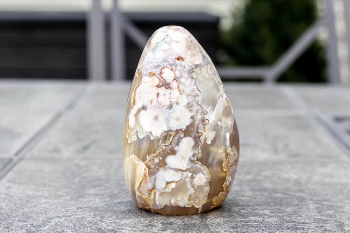 A flower agate free form on a table.