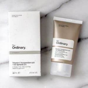 The Ordinary Vitamin C Suspension 23% box and tube on a marble background.
