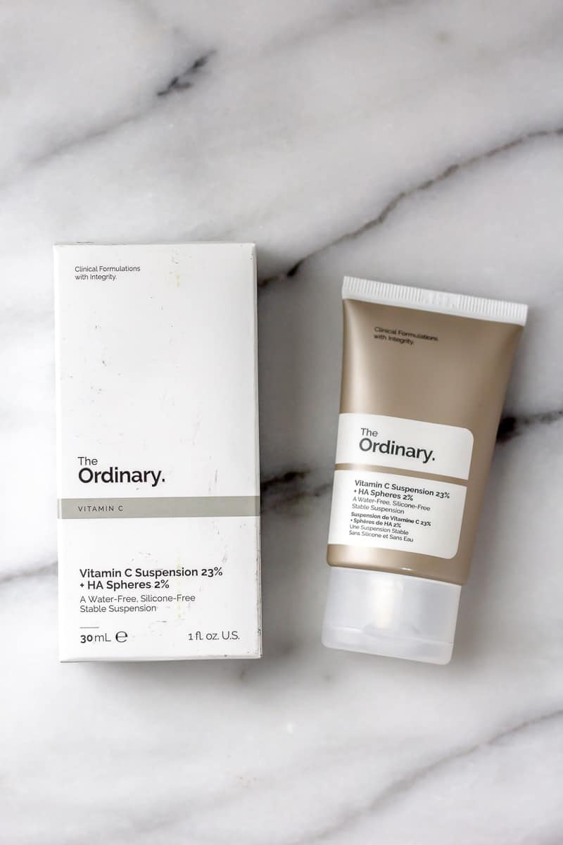 The Ordinary Vitamin C Suspension 23% box and tube on a marble background.