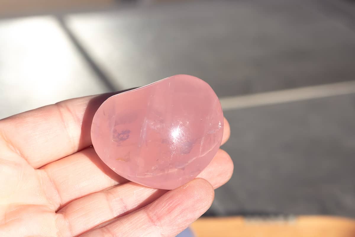 A rose quartz heart carving.