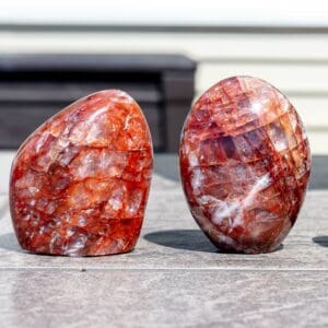 Two red hematoid quartz free forms.