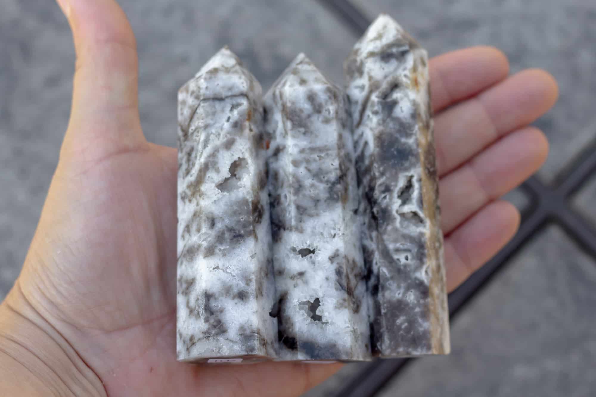 Three sphalerite towers in a hand.