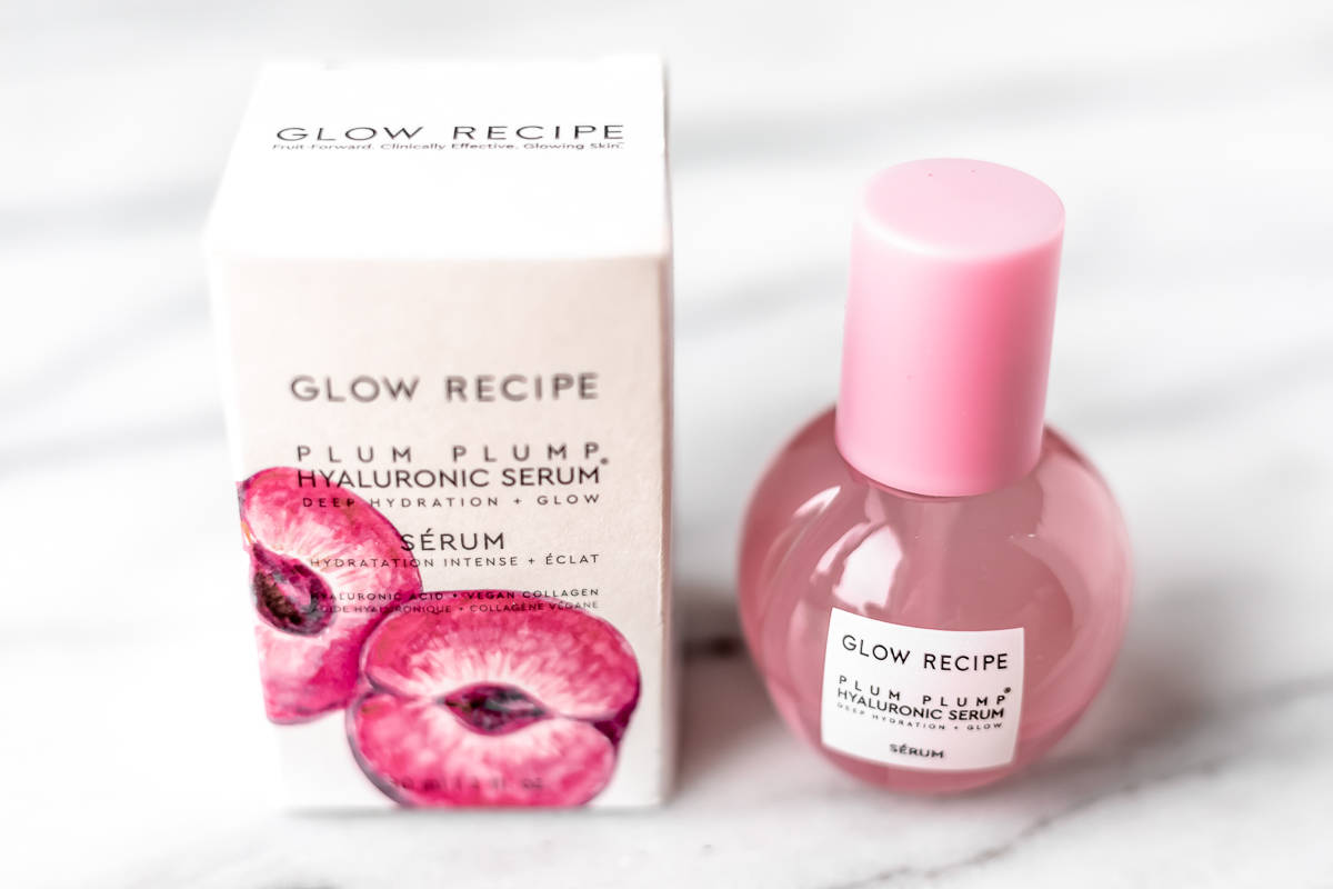 Glow recipe plum plump bottle and its box on a marble background.