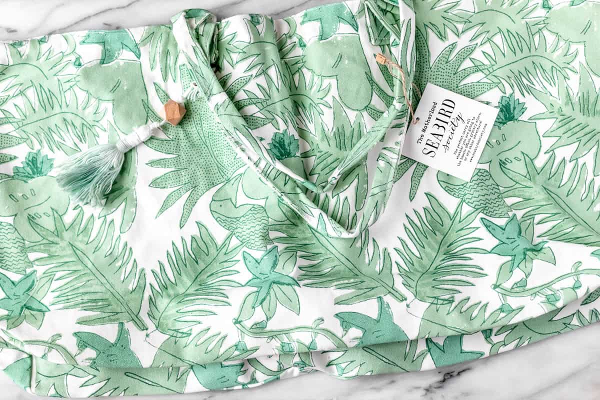 A green and white Birds of Paradise Tote by Seabird Society.